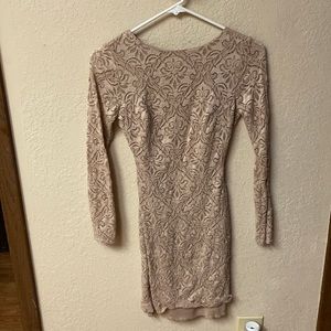 Nude, bodycon dress with open back. Very comfy and only worn once